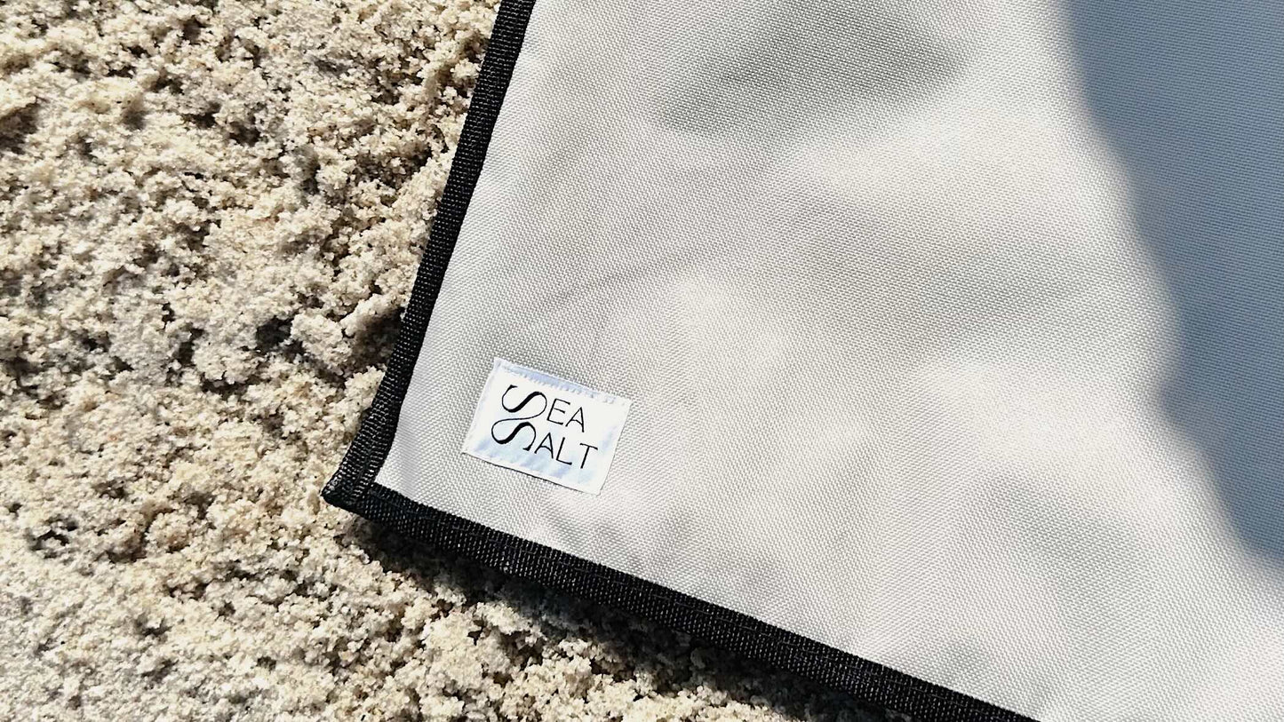 close up sea salt logo on the beach chair in the sand